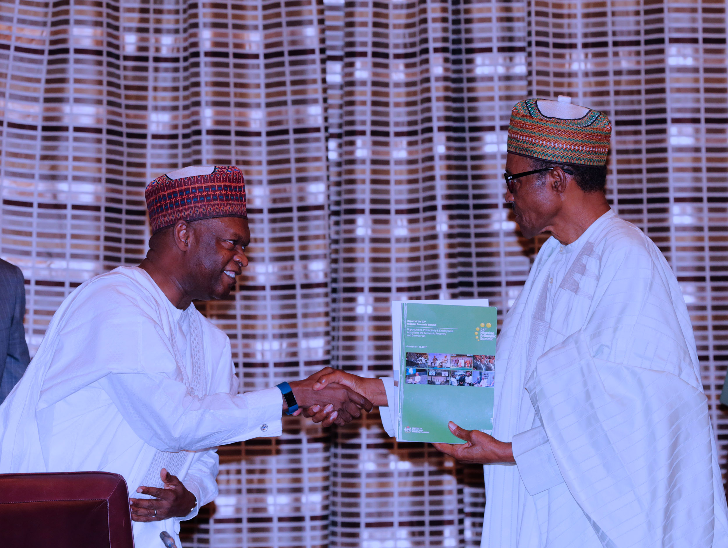 President Muhammadu Buhari receives NESG working document from Kyari Bukar, the Chairman Nigerian Economic Summit Group, NESG, during a courtesy visit by the Board and Management of the Nigeria Economic Summit Group (NESG) at the State House in Abuja. PHOTO; SUNDAY AGHAEZE. JAN 22 2018